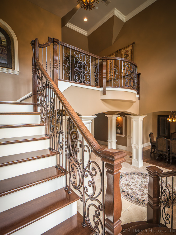 Photo of a traditional wood l-shaped staircase in Chicago with painted wood risers.