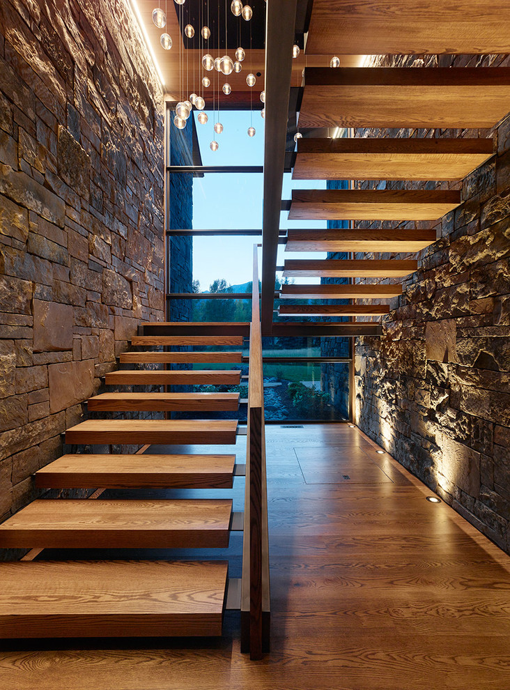 Country wood u-shaped staircase in Other with open risers.