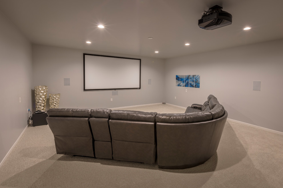 Inspiration for a mid-sized transitional enclosed carpeted home theater remodel with gray walls and a projector screen