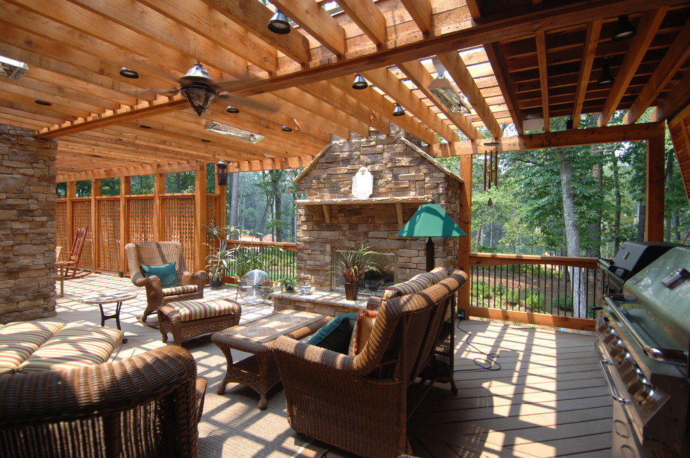 Design ideas for an expansive country backyard deck in Atlanta with an outdoor kitchen and a pergola.