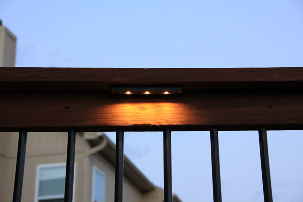 Deck lighting using low under railing LED lights american-traditional-terrace