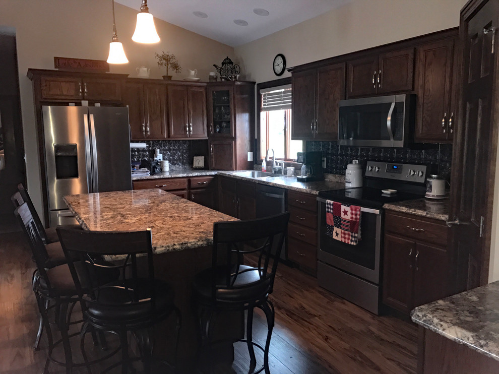 Inspiration for a brown floor kitchen remodel with brown cabinets, brown backsplash, an island and brown countertops