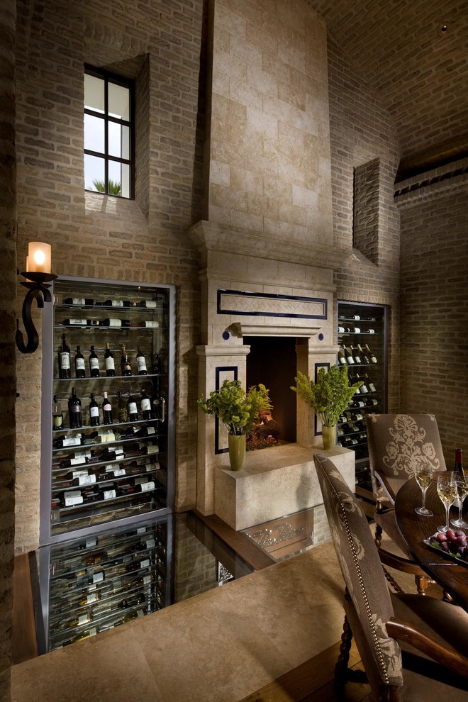 Design ideas for a traditional wine cellar in San Diego with display racks.