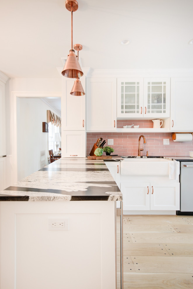 Inspiration for a large country l-shaped eat-in kitchen in Other with a farmhouse sink, recessed-panel cabinets, white cabinets, granite benchtops, pink splashback, ceramic splashback, stainless steel appliances, light hardwood floors, a peninsula, beige floor and multi-coloured benchtop.