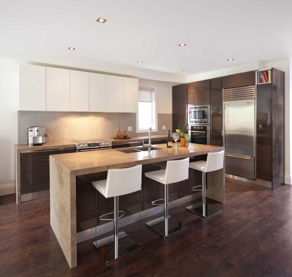 Design ideas for a modern l-shaped kitchen in Toronto with flat-panel cabinets, dark wood cabinets, grey splashback and limestone splashback.