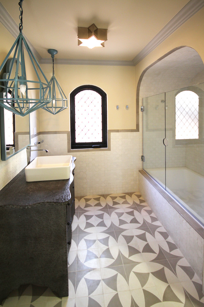 This is an example of a small transitional 3/4 bathroom in San Diego with a vessel sink, furniture-like cabinets, grey cabinets, zinc benchtops, a drop-in tub, a shower/bathtub combo, white tile, ceramic tile, black walls and ceramic floors.