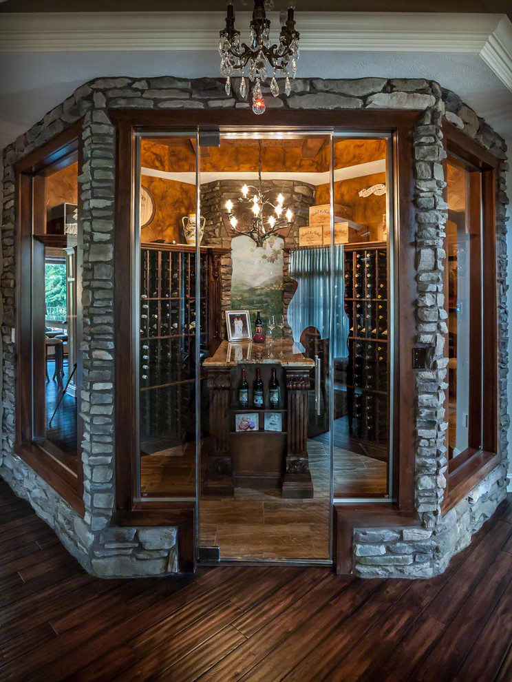 Large eclectic wine cellar in Cleveland with porcelain floors and storage racks.