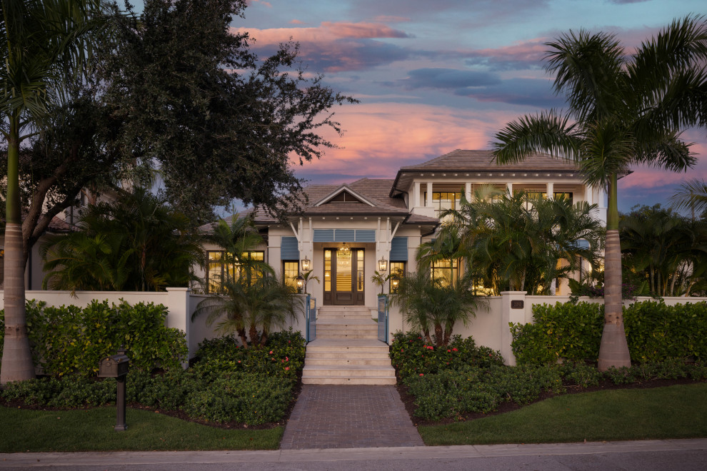 Inspiration for a large coastal two-story exterior home remodel in Tampa
