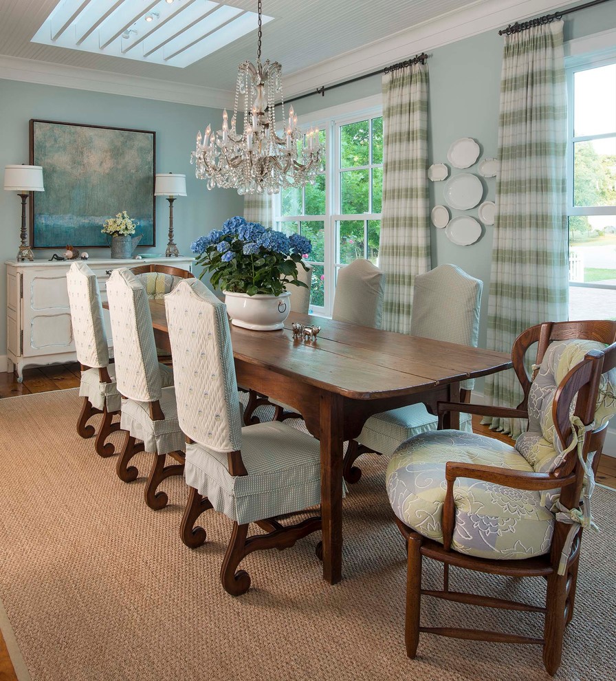 Design ideas for a country dining room in Dallas with blue walls and dark hardwood floors.