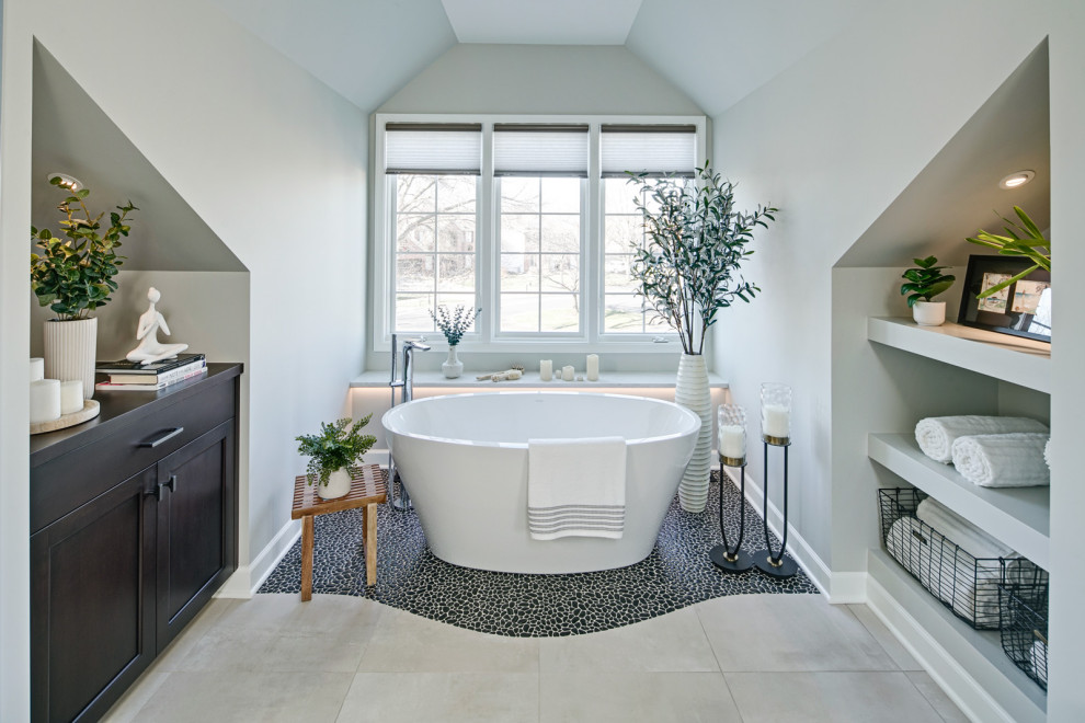 Example of a large transitional master beige tile and ceramic tile ceramic tile, beige floor and double-sink bathroom design in Chicago with flat-panel cabinets, brown cabinets, a bidet, gray walls, an undermount sink, quartz countertops, a hinged shower door, white countertops and a built-in vanity