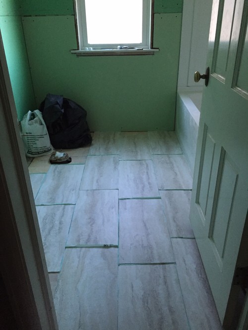 Which direction should I lay the 12x24 vinyl tiles in our bathroom?