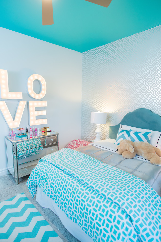 Contemporary kids' room in Sacramento with blue walls for girls and kids 4-10 years old.