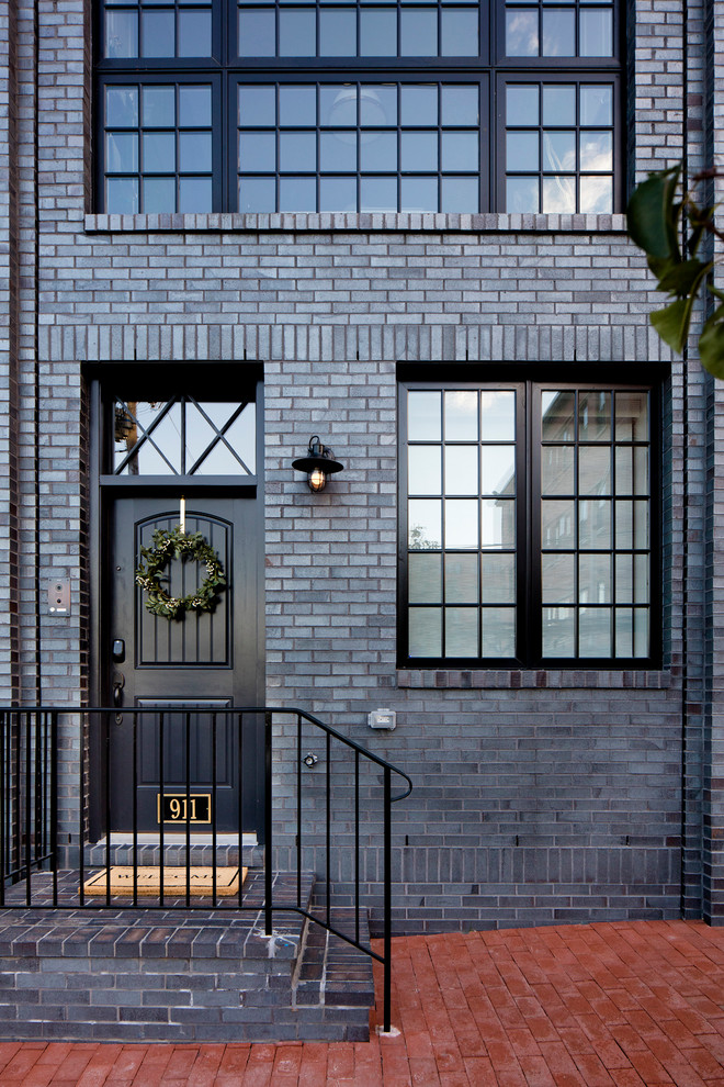 Photo of a transitional brick black exterior in Baltimore.