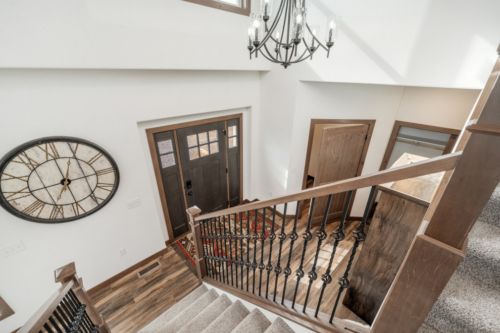 Example of a mountain style single front door design in Minneapolis with a dark wood front door