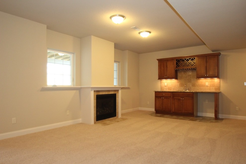Inspiration for a huge transitional look-out carpeted home design remodel in Milwaukee with gray walls, a standard fireplace and a tile fireplace