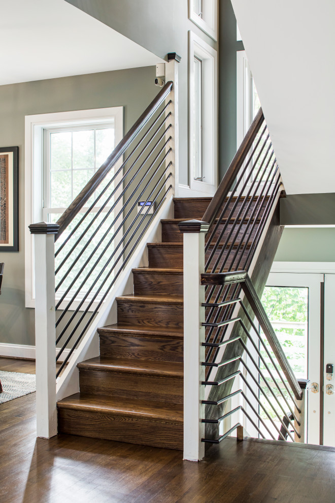 Ejemplo de escalera en L minimalista con escalones de madera y barandilla de madera