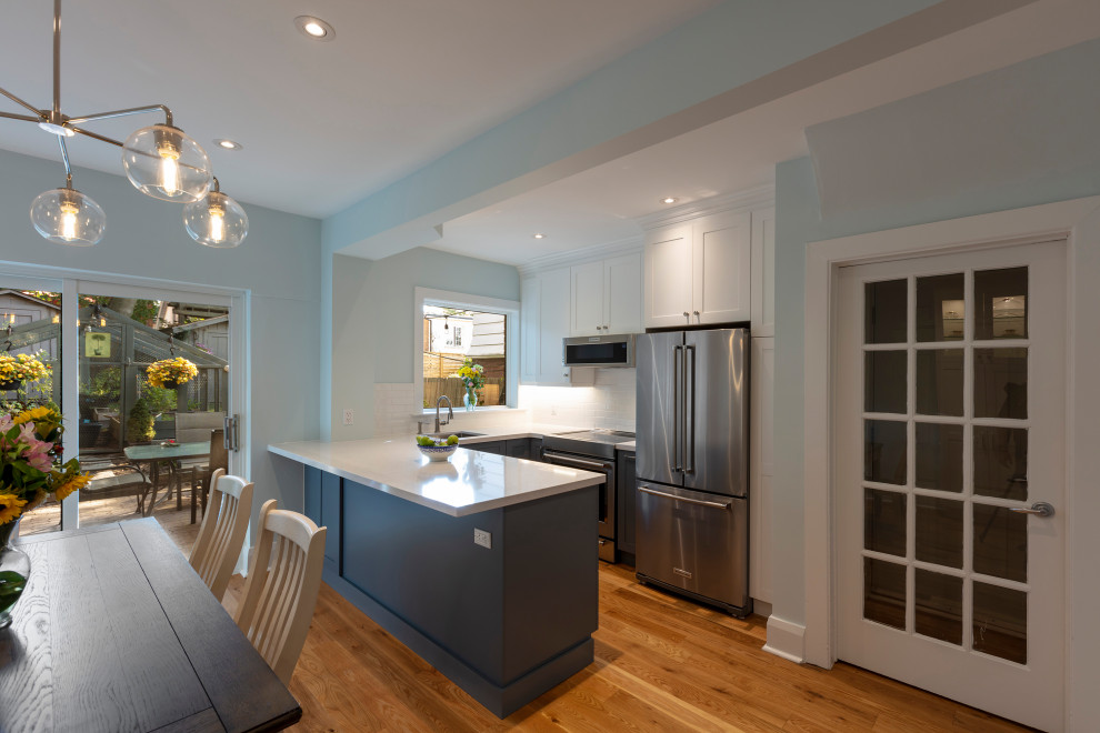 Example of a transitional kitchen design in Toronto