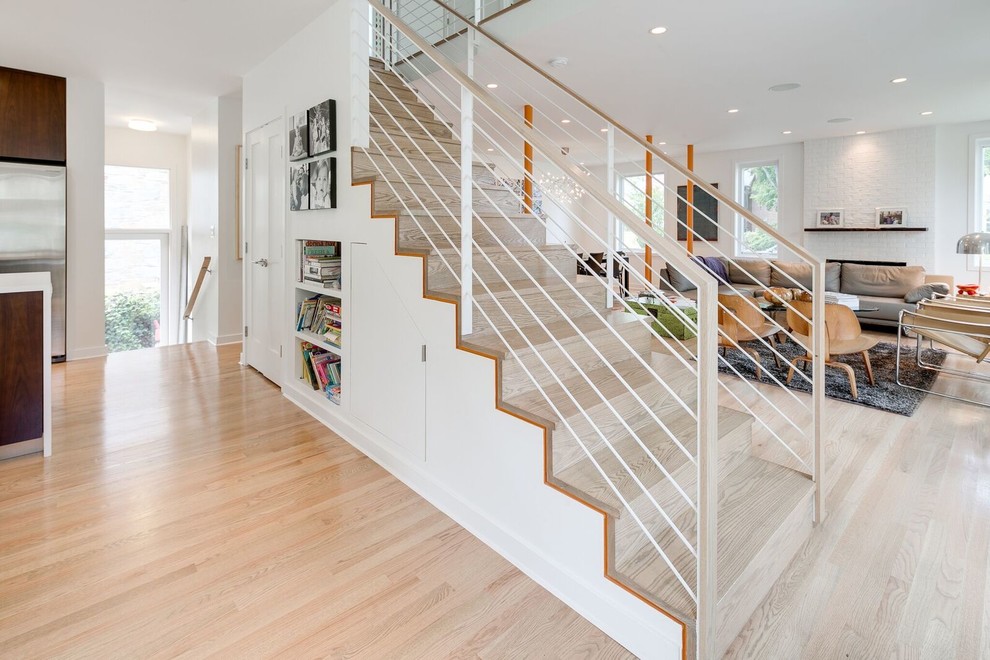 This is an example of a contemporary wood straight staircase in DC Metro with wood risers and mixed railing.