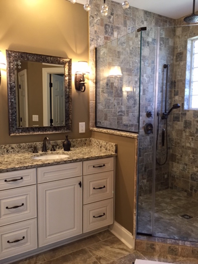 Design ideas for a mid-sized contemporary master bathroom in Atlanta with raised-panel cabinets, white cabinets, an undermount sink, granite benchtops and beige benchtops.