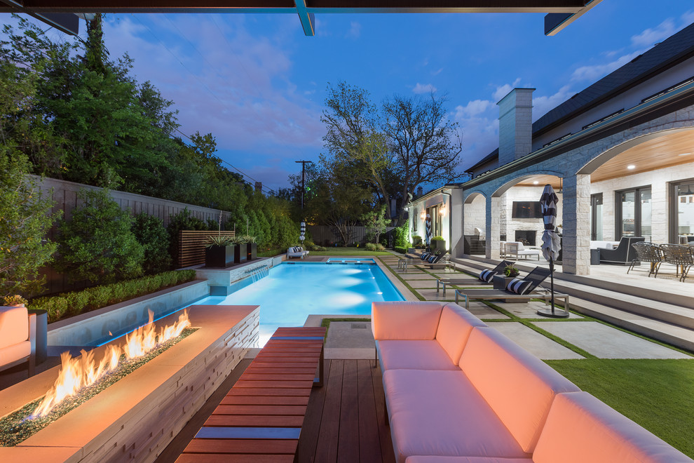 Design ideas for a mid-sized modern backyard rectangular pool in Dallas with a hot tub and concrete slab.