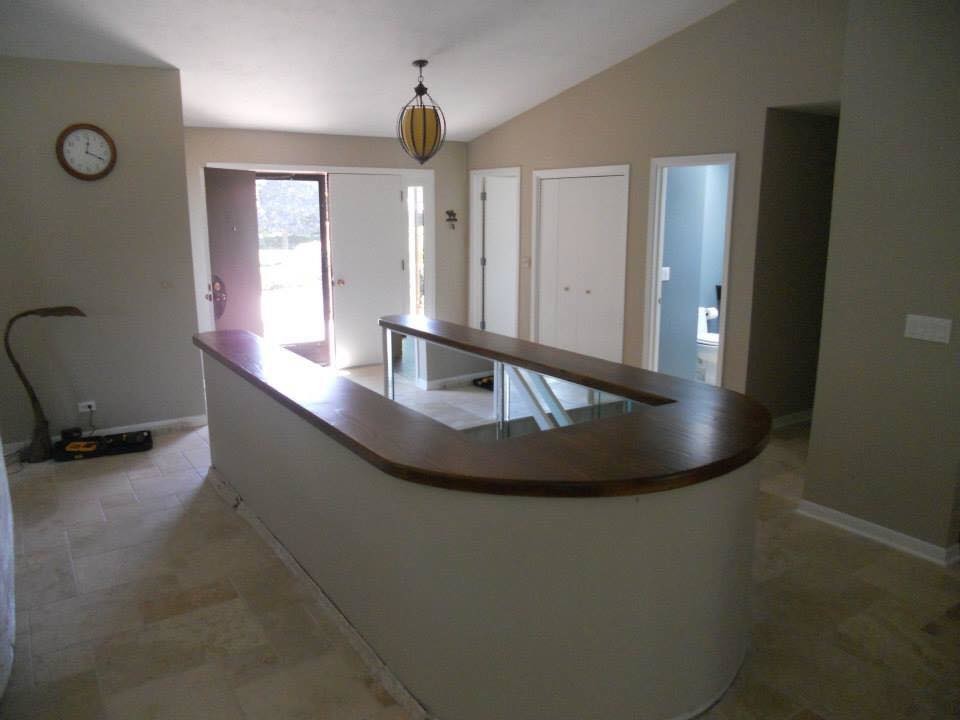 Inspiration for a large transitional travertine floor and beige floor foyer remodel in Chicago with beige walls and a white front door