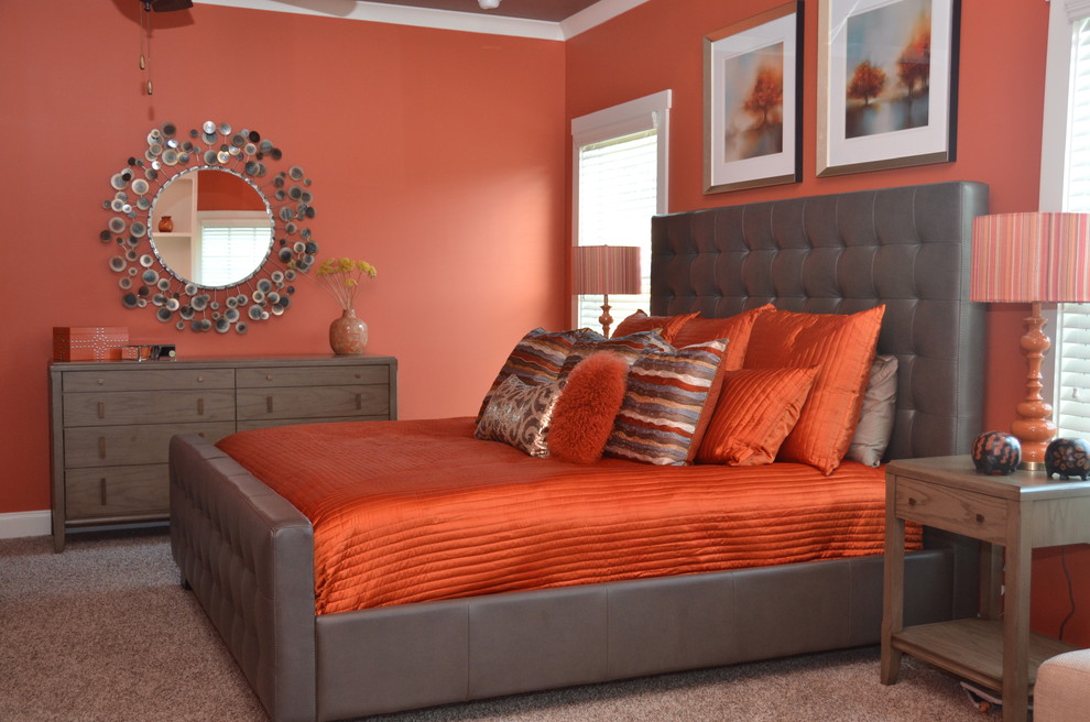Photo of a large eclectic master bedroom in Atlanta with orange walls, carpet, no fireplace and grey floor.
