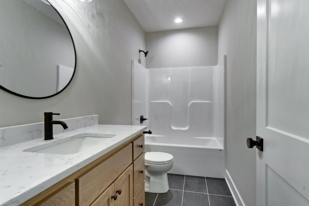 Transitional bathroom photo with shaker cabinets, medium tone wood cabinets and a built-in vanity
