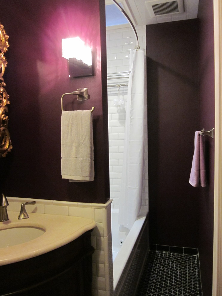 Inspiration for a small midcentury 3/4 bathroom in Boston with an alcove tub, an alcove shower, white tile, ceramic tile, purple walls, an undermount sink, black floor and a shower curtain.