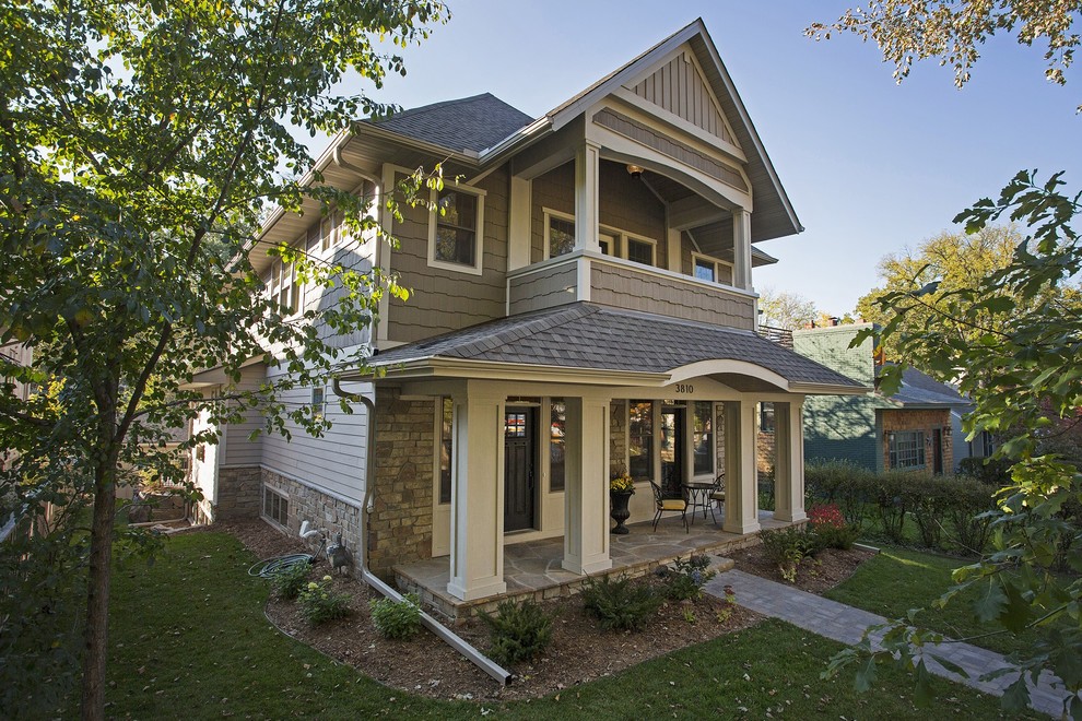 Design ideas for a mid-sized transitional two-storey beige exterior in Minneapolis with mixed siding.