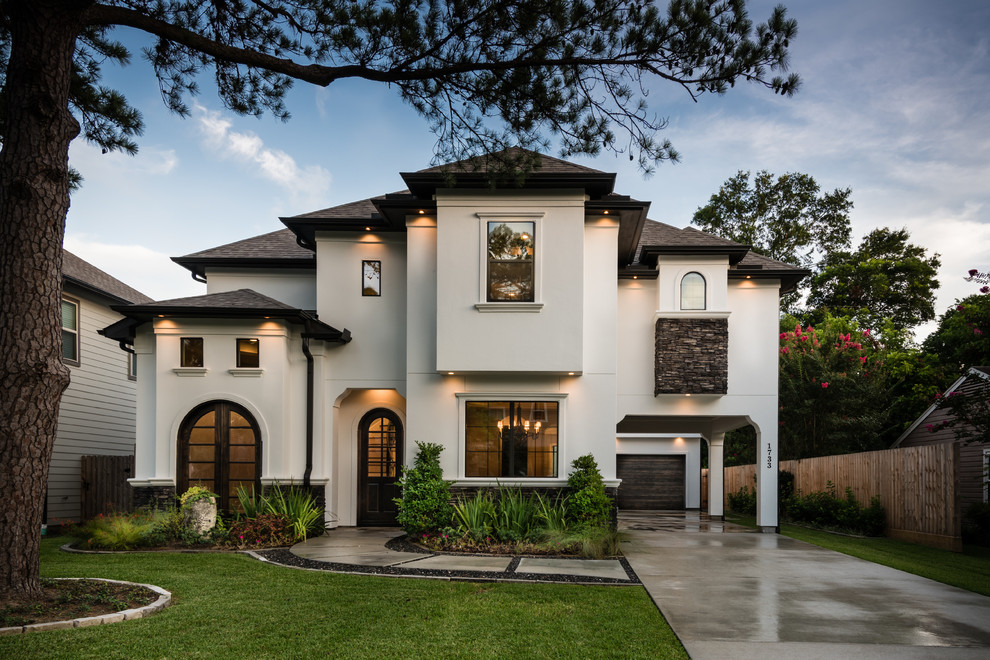 Large traditional two-storey stucco white exterior in Houston.