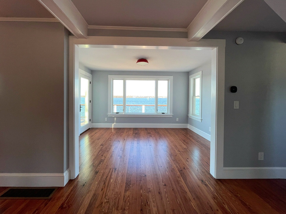 Inspiration for a small coastal medium tone wood floor sunroom remodel in Providence with a standard ceiling
