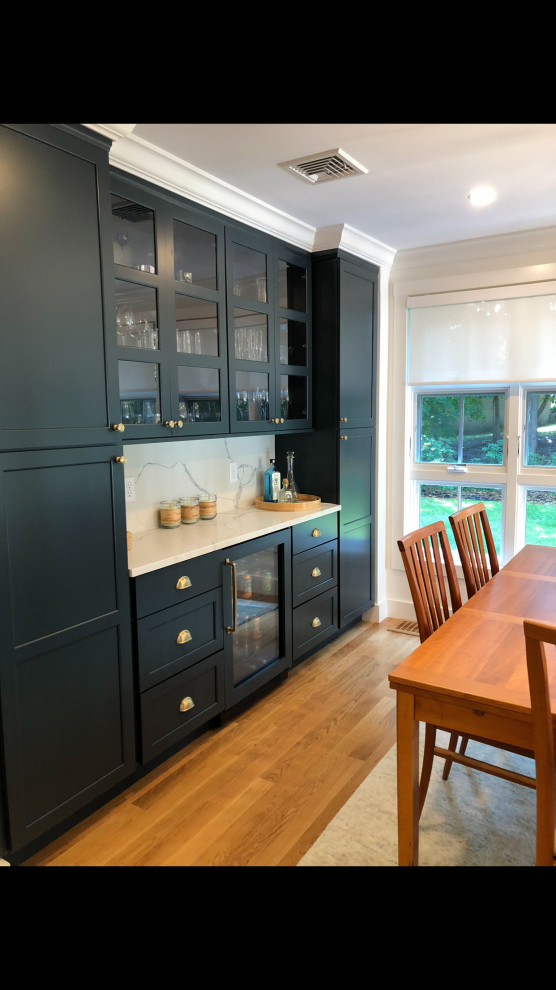 This is an example of a transitional dining room in Boston.