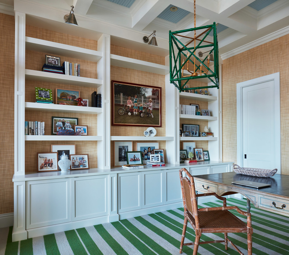 This is an example of a beach style home office in Miami with green floor.