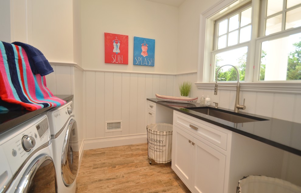 Design ideas for a beach style laundry room in New York.