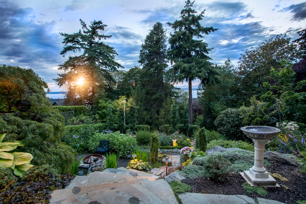 Design ideas for a large traditional backyard full sun formal garden for spring in Seattle with natural stone pavers and a garden path.