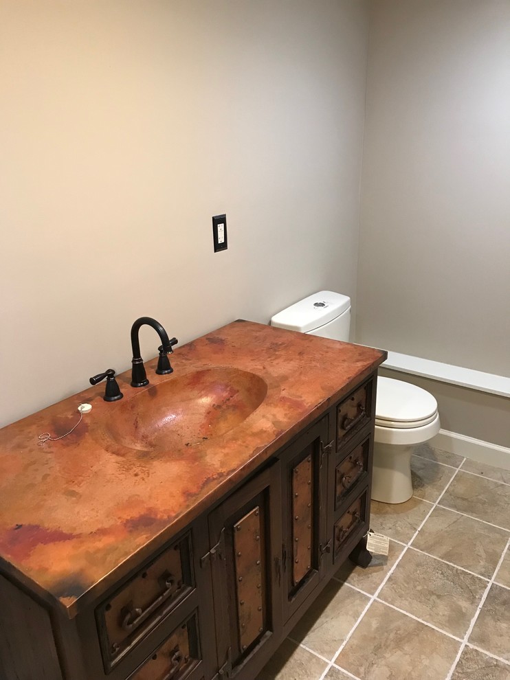 Design ideas for a mid-sized master bathroom in Bridgeport with recessed-panel cabinets, dark wood cabinets, an alcove shower, a two-piece toilet, beige walls, ceramic floors, an integrated sink, copper benchtops, beige floor and an open shower.