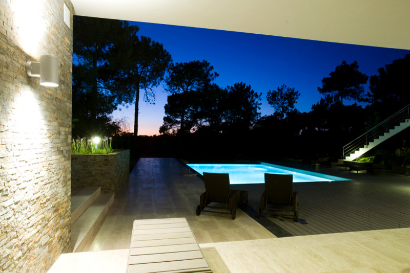 Mid-sized transitional backyard balcony deck photo with a roof extension