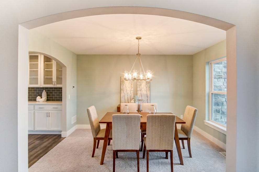 Mid-sized transitional carpeted and gray floor enclosed dining room photo with green walls and no fireplace