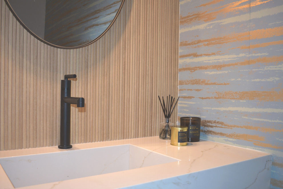 Small asian bathroom in Los Angeles with a one-piece toilet, wood-look tile, an integrated sink, a floating vanity and wallpaper.