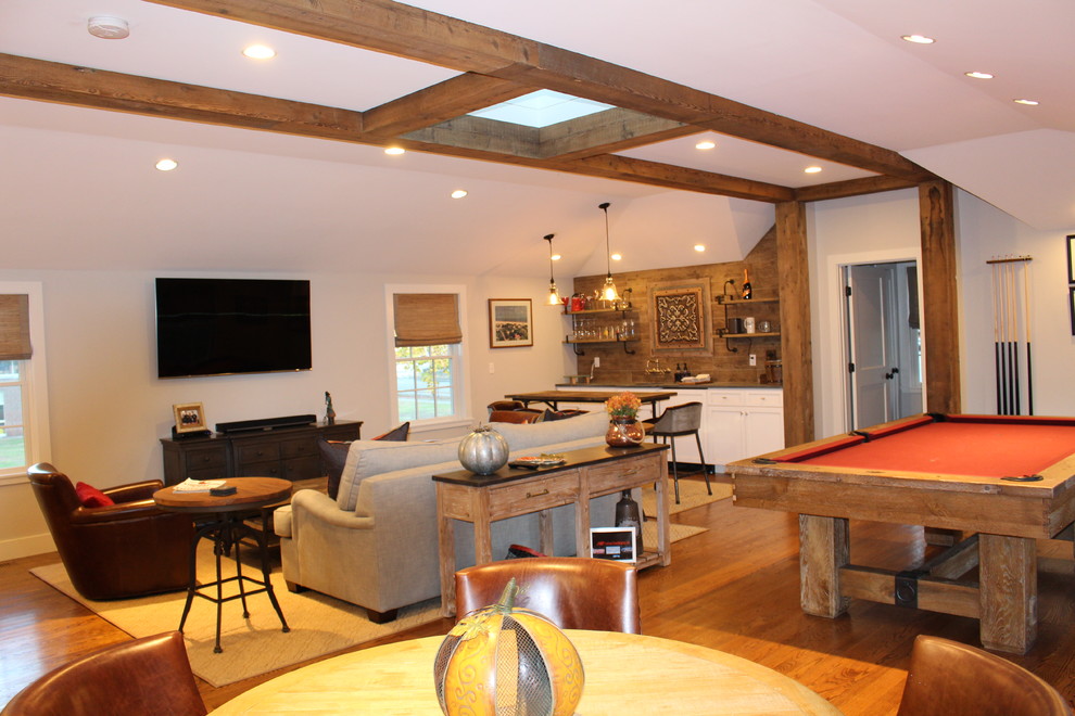 Mid-sized arts and crafts enclosed family room in Boston with a game room, grey walls, dark hardwood floors, a wall-mounted tv, brown floor, exposed beam and vaulted.