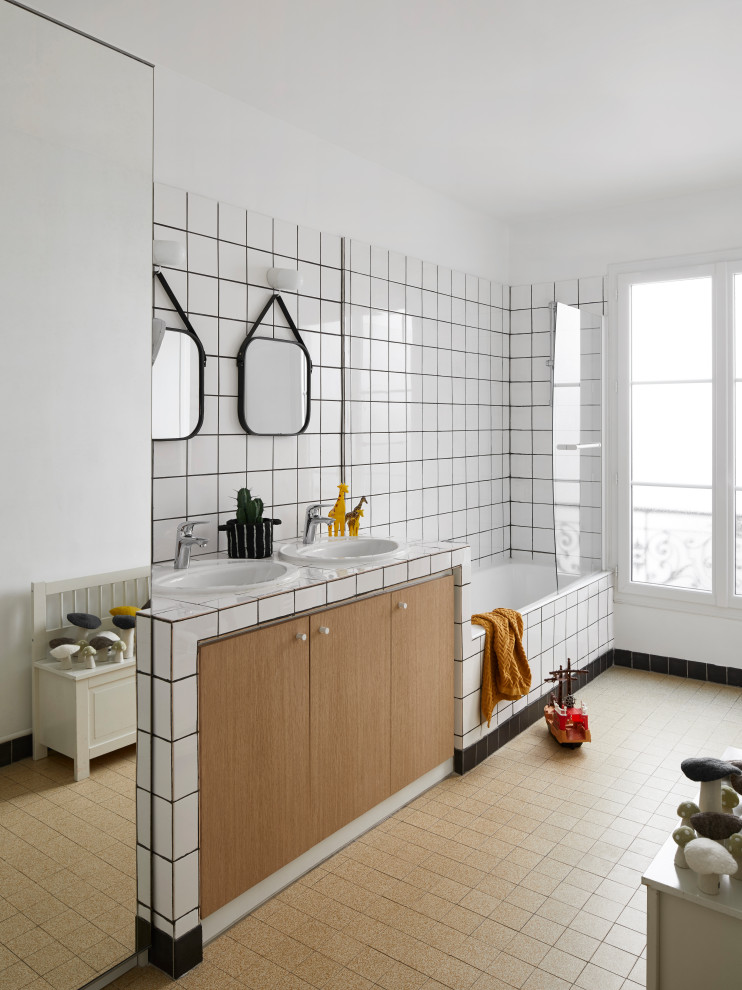 Design ideas for a large contemporary kids bathroom in Paris with flat-panel cabinets, medium wood cabinets, a drop-in tub, a shower/bathtub combo, white tile, white walls, a drop-in sink, brown floor, multi-coloured benchtops, a double vanity and a built-in vanity.