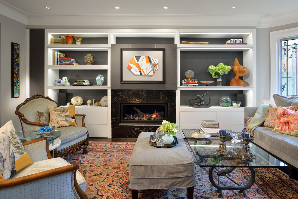 This is an example of a contemporary living room in Toronto with a concealed tv, grey walls and a ribbon fireplace.
