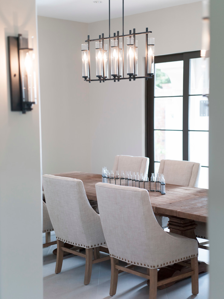 Transitional enclosed dining room photo in Austin with white walls