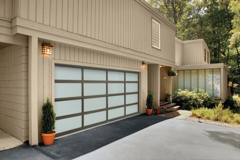 Photo of a mid-sized contemporary attached two-car garage in Austin.
