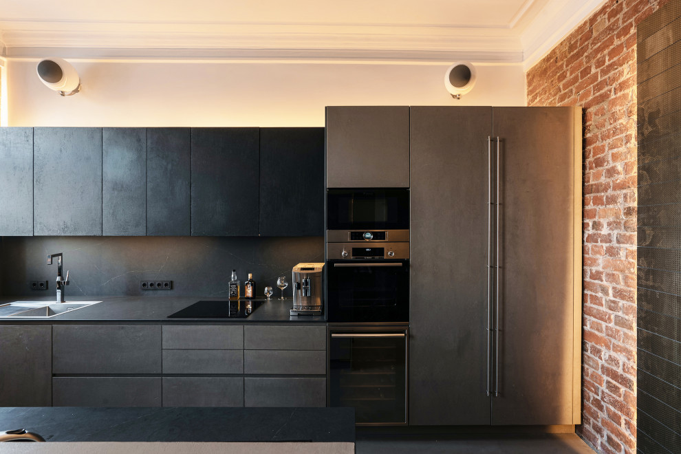 Example of a large urban single-wall concrete floor, blue floor and exposed beam eat-in kitchen design in Saint Petersburg with an undermount sink, flat-panel cabinets, black cabinets, quartz countertops, black backsplash, quartz backsplash, paneled appliances, an island and black countertops