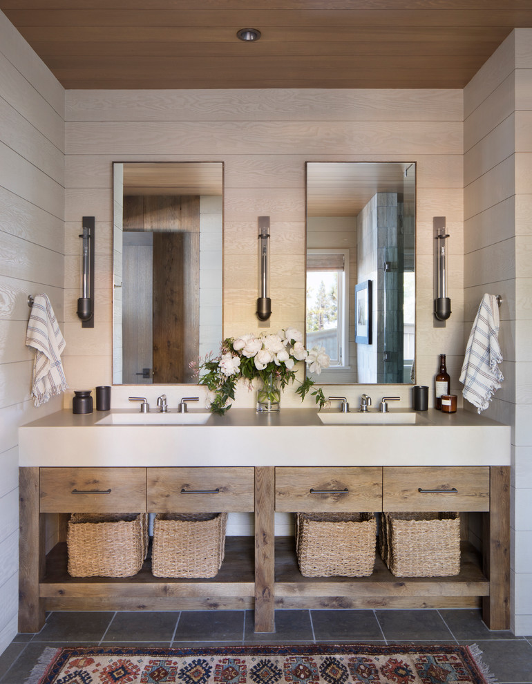 Design ideas for a country bathroom in San Francisco with flat-panel cabinets, medium wood cabinets, beige walls, an integrated sink, grey floor and beige benchtops.