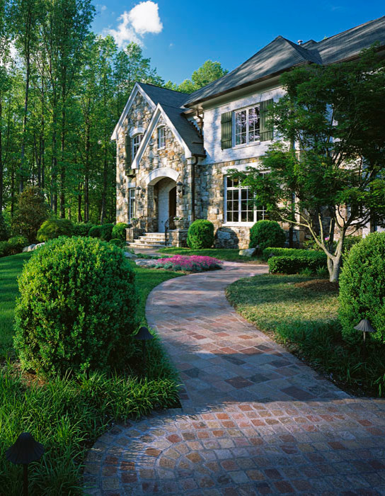Inspiration for a mid-sized traditional backyard full sun garden in DC Metro with brick pavers.