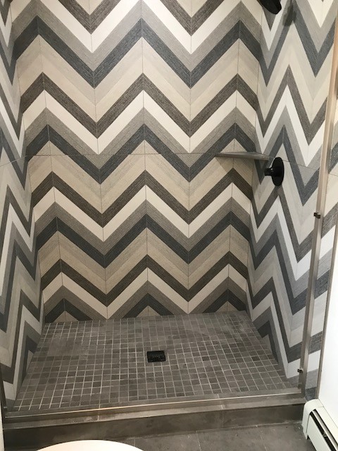 Alcove shower - transitional multicolored tile and porcelain tile alcove shower idea in Denver