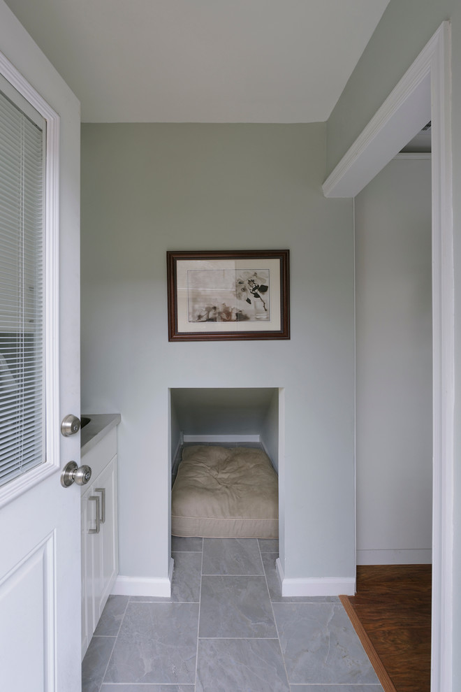 Eat-in kitchen - small traditional u-shaped medium tone wood floor and gray floor eat-in kitchen idea in DC Metro with an undermount sink, raised-panel cabinets, white cabinets, granite countertops, beige backsplash, glass tile backsplash, stainless steel appliances and an island