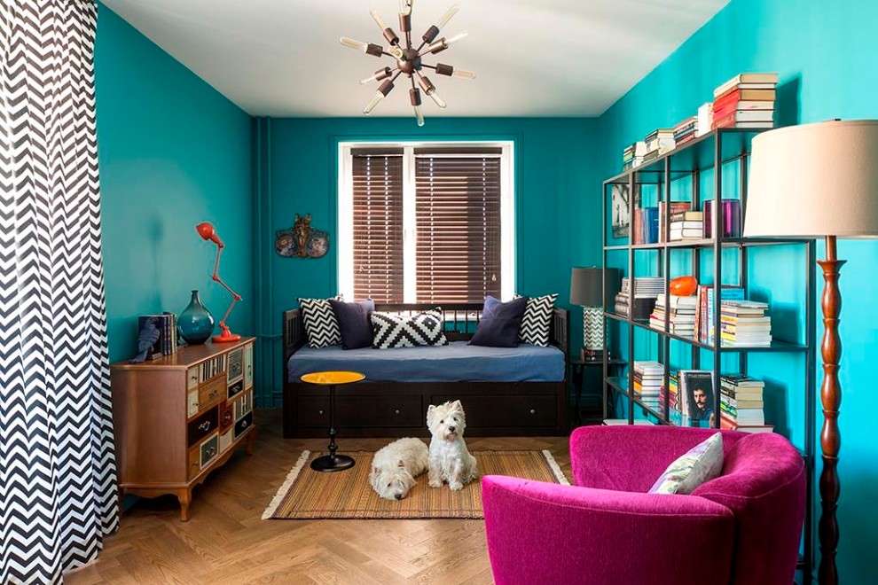 This is an example of an eclectic family room in Moscow with a library, blue walls, medium hardwood floors and no fireplace.